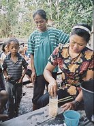 Participants in the Farmer Field School learn the techniques for determining which seed are good, and which are bad.