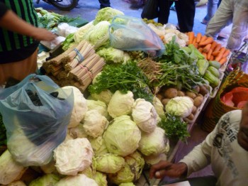 Market vendor selling vegetables in Pangkalan Bun